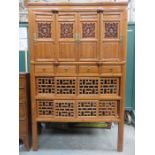 CARVED PIERCEWORK DECORATED ORIENTAL CABINET WITH FOUR DOORS TO TOP,