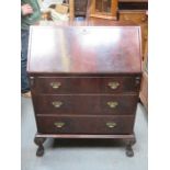 MAHOGANY FALL FRONT WRITING BUREAU ON BALL AND CLAW SUPPORTS WITH FITTED INTERIOR