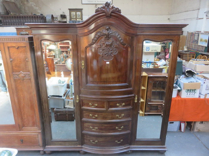 VICTORIAN CARVED AND BOW FRONTED MAHOGANY TRIPLE WARDROBE