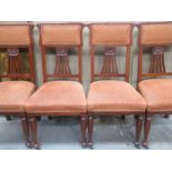 SET OF FOUR CARVED AND PIERCEWORK DECORATED UPHOLSTERED CHAIRS
