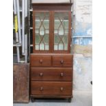 19th CENTURY OAK TWO DOOR ASTRAGAL GLAZED BOOKCASE UPON TWO OVER TWO CHEST BASE