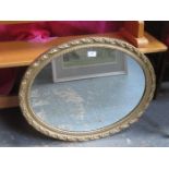 OVAL GILT FRAMED WALL MIRROR,