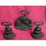 THREE CAST IRON DOOR STOPS