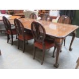 MAHOGANY EXTENDING DINING TABLE WITH TWO LEAVES AND SIX BERGERE BACKED DINING CHAIRS