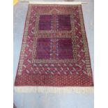MIDDLE EASTERN STYLE HAND KNOTTED FLOOR RUG, CONVERTED TO WALL HANGING WITH BRASS RAIL,