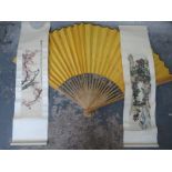 TWO SIMILAR ORIENTAL SILK WALL HANGING AND OVERSIZED HAND FAN