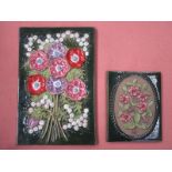 PAIR OF GLAZED FLORAL POTTERY WALL PLAQUES,