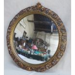 VICTORIAN GILDED AND PIERCEWORK DECORATED CIRCULAR CONVEX WALL MIRROR,