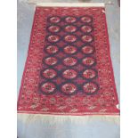 MIDDLE EASTERN STYLE HAND KNOTTED FLOOR RUG, CONVERTED TO WALL HANGING WITH BRASS RAIL,