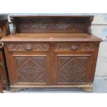 HEAVILY CARVED OAK SIDEBOARD