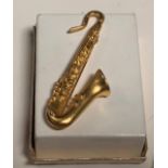 Saxophone tie pin brooch stamped Kenneth Lane