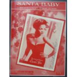 Eartha Kitt signed Santa Baby Sheet music framed and glazed. 30cms x 22cms