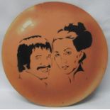 Circular wooden plaque with Sonny & Cher possibly used on Sonny & Cher Show