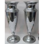 Pair of Large urn form silver plated vases. App 51cm High