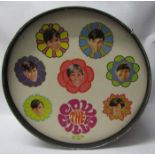 Cowsills 1969 part Drum set featuring the group on bass drum, with smaller drums and cymbles,