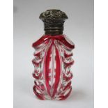 Victorian ruby overlay cut glass scent / perfume bottle, with ornately repousse decorated hinged cap