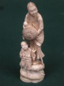 19th century heavily carved Chinese / Japanese ivory figure group depicting a lady with children.