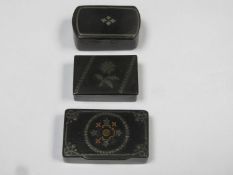 Three various hinged victorian ebonised snuff boxes, all with silver coloured metal inlay to lids