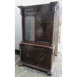 Heavily carved 19th century oak barley twist decocted two door glazed bookcase with cupboard door