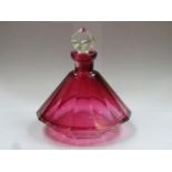 19th century cranberry glass facet cut 14 sided perfume decanter, complete with original stopper.