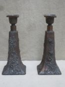 Pair of 19th century Oriental relief floral decorated copper candlesticks. Approx. 23cms high