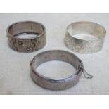 Three various hallmarked silver bangles, various makers, assay marks and dates. Total weight Approx.