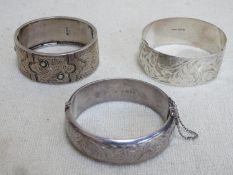 Three various hallmarked silver bangles, various makers, assay marks and dates. Total weight Approx.