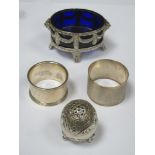 Silver oval open salt with blue glass liner and on raised supports, stamped 800. Also two silver