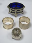 Silver oval open salt with blue glass liner and on raised supports, stamped 800. Also two silver