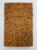 19th century Chinese heavily carved boxwood calling card case, decorated with figures, pagodas and