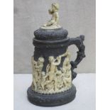 19th century unglazed black basalt style lidded pottery tankard, relief decorated in the Wedgwood