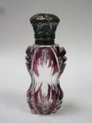 Victorian purple overlay cut glass scent / perfume bottle, with ornately repousse decorated hinged