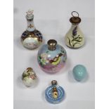 Parcel of seven ceramic perfume bottles, various sizes and designs inc. silver topped and hand