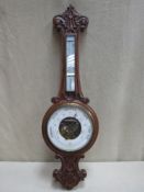 Victorian carved oak cased aneroid banjo barometer, with enamelled skeleton dial and mounted