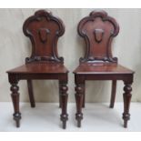 Pair of Victorian mahogany shield backed hall chairs