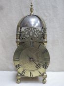 17th / 18th century brass lantern clock on raised supports and with double chain driven fusee
