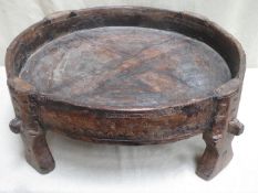 Antique Mororccan hand made rustic circular bread making table, on raised supports, with primitive