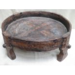 Antique Mororccan hand made rustic circular bread making table, on raised supports, with primitive