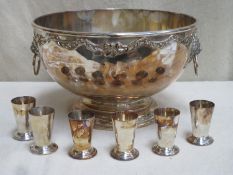 Large vintage silver plated punch bowl, decorated with relief work scrolls and lion head loop