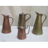 Two art nouveau copper and brass repousse decorated water jugs, plus two similar lidded water