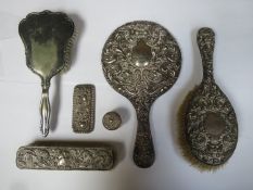 Parcel of hallmarked silver dressing table items, including hand mirror, two brushes and pin jar