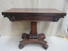 Victorian Rosewood fold over games table with carved decoration on Quadrofoil supports