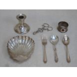 Mixed lot of silver including candle stand, sugar tongs, shell form receiver, enamelled napkin ring,