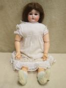 Early 20th century Armand Marseille bisque headed and voiced doll, impressed 3200, A M 2/0 DEP, with