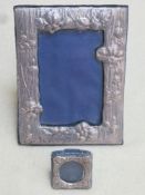 Hallmarked silver repousse decorated free standing photo frame, plus a smaller circular hallmarked