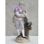 19th century Meissen hand painted and gilded ceramic figure depicting a young gent collecting