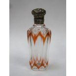 Victorian orange overlay cut glass scent / perfume bottle, with ornately repousse decorated hinged