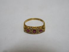 18ct gold dress ring set with ruby coloured stones & clear stones