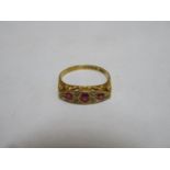 18ct gold dress ring set with ruby coloured stones & clear stones
