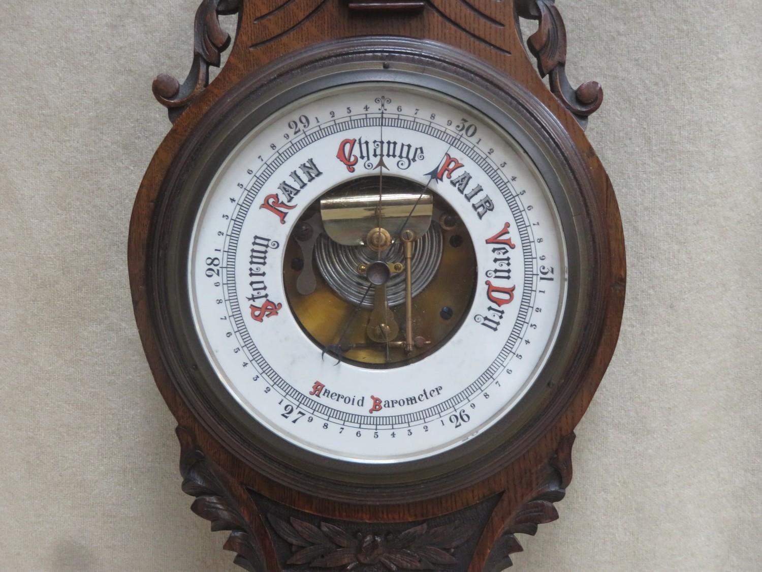 Victorian carved oak cased aneroid banjo barometer, with enamelled skeleton dial and mounted - Image 2 of 2